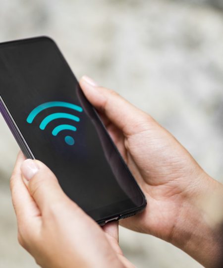 close-up-phone-hands-with-wifi-symbol.jpg close-up-phone-hands-with-wifi-symbol.jpg